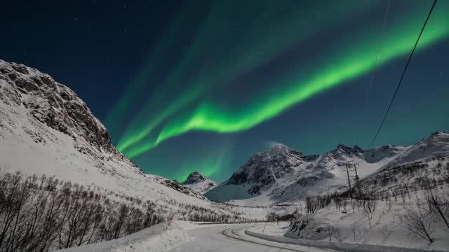 Northern lights over snowy mountains AI video example